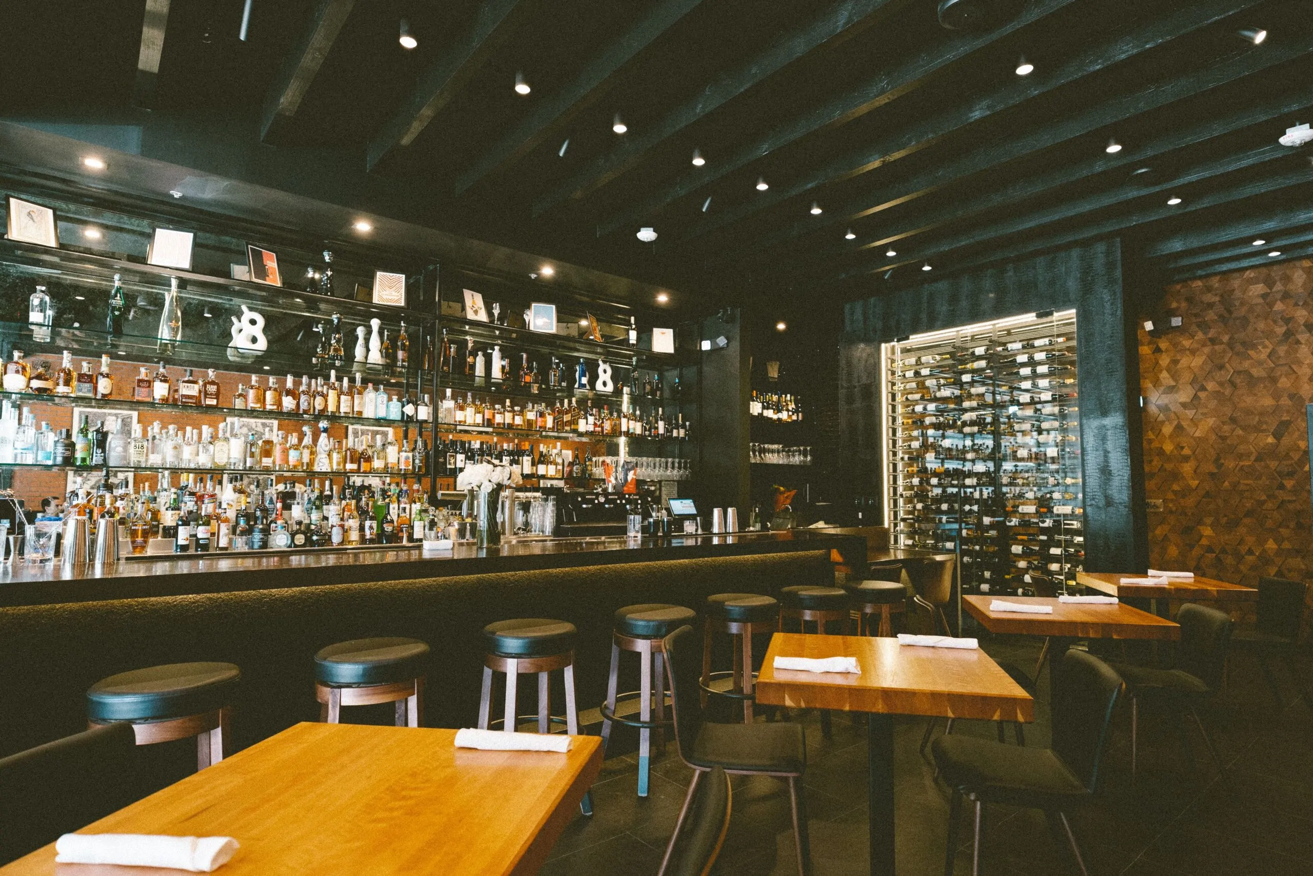 Beverly Bar interior with backlit bottle display and warm ambient lighting